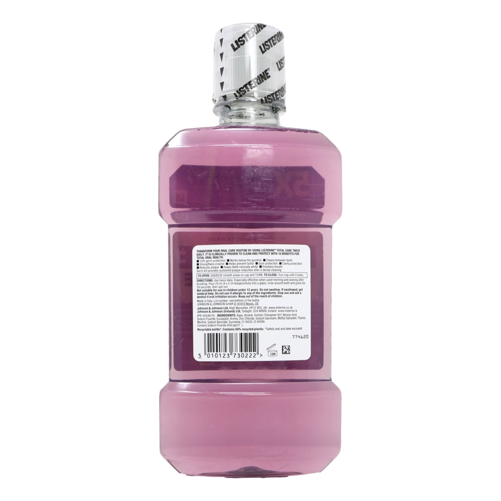 Pink bottle of Listerine mouthwash on a white background