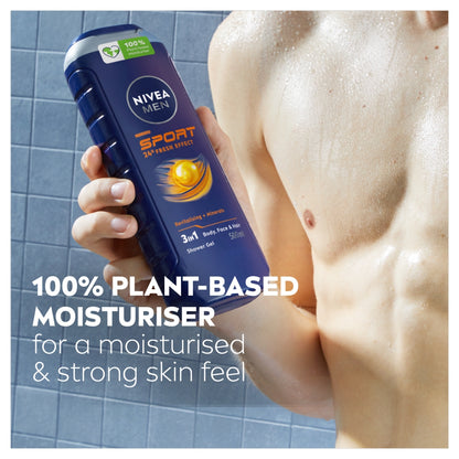 Nivea Men Sport shower gel being held by a person with a tiled background