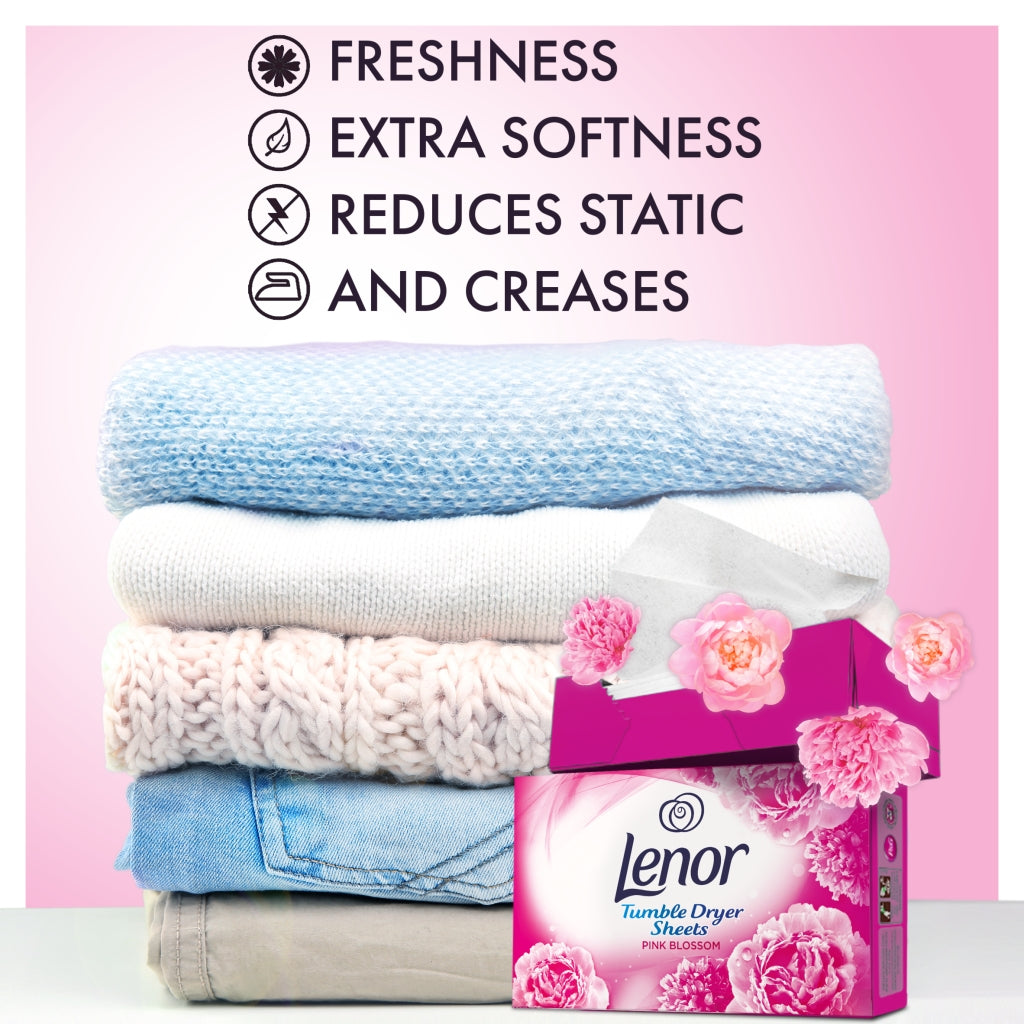 Lenor fabric softener sheets packaging with a stack of folded clothes on a pink background
