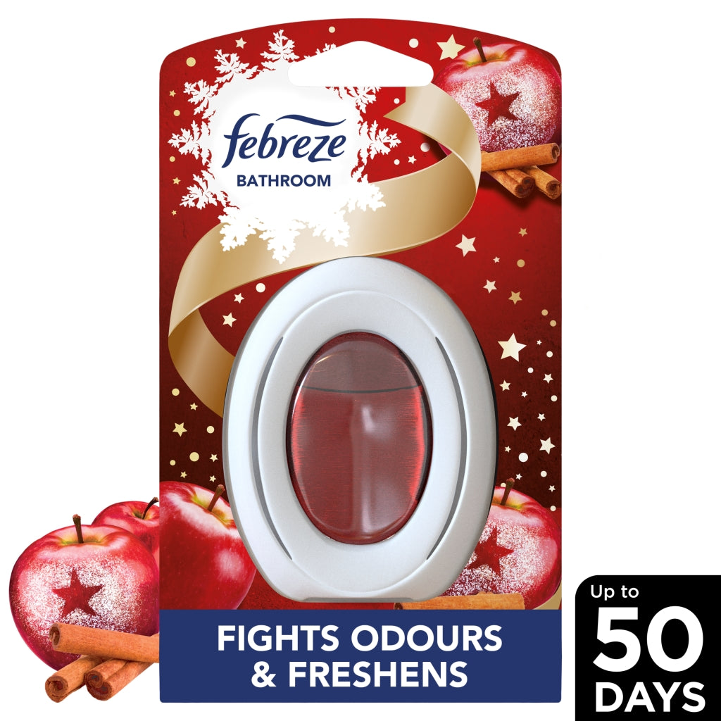 Febreze bathroom air freshener with red apples and cinnamon sticks on a white background