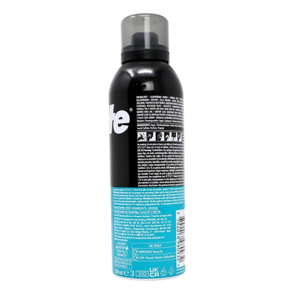 Black spray bottle with a blue label on a white background