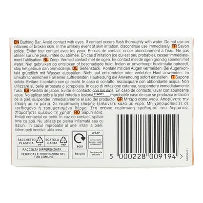 Back of a soap packaging with text and bar code on a white background